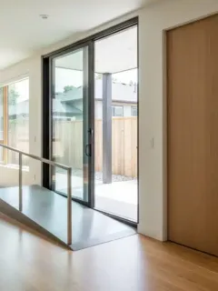 Accessible home interior with ramp, wide doorways, and grab bars, illustrating HATC 2026 eligible renovations.